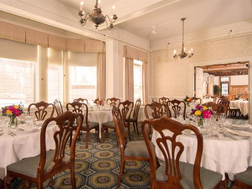 Our Founders room is set with multiple tables and chairs.