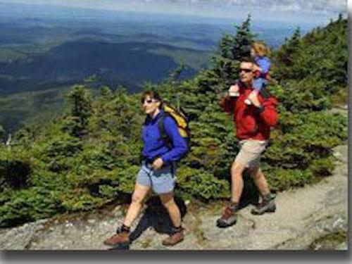 A family hikes on a mountain